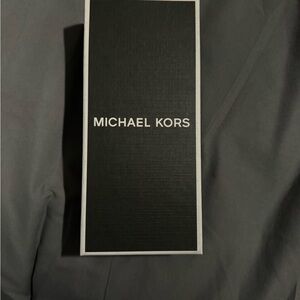 Michael Kors Airpod holder with lanyard. Brand new